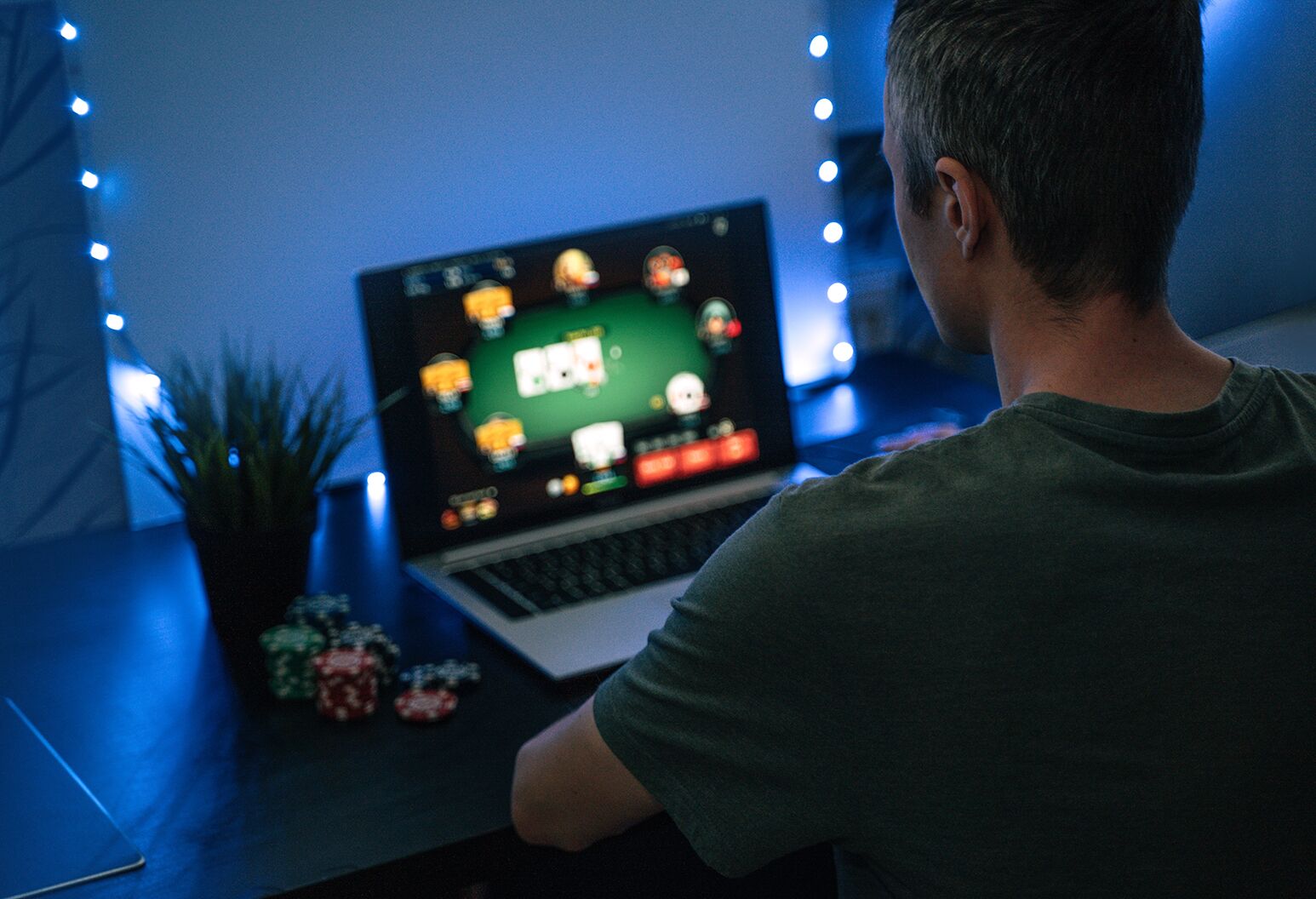 A man on a gambling site on his laptop.