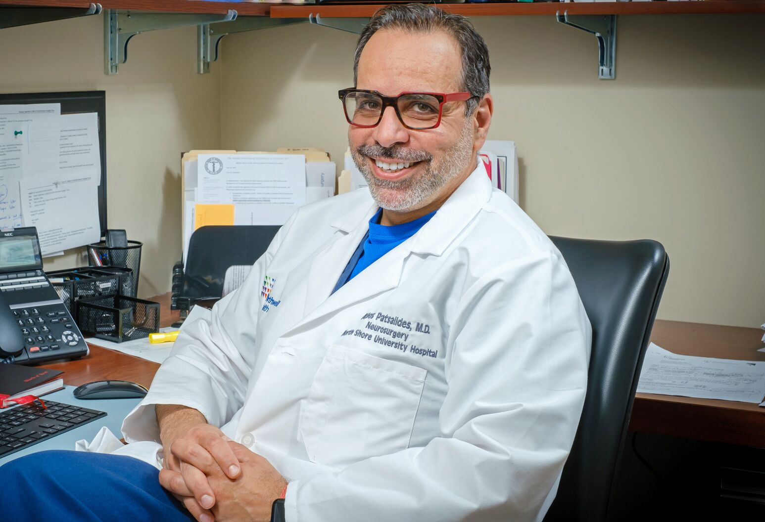 Athos Patsalides, MD, in his office at the Institute for Neurology and Neurosurgery. The renowned interventional neuroradiologist strengthens North Shore University Hospital's neurosciences capabilities.