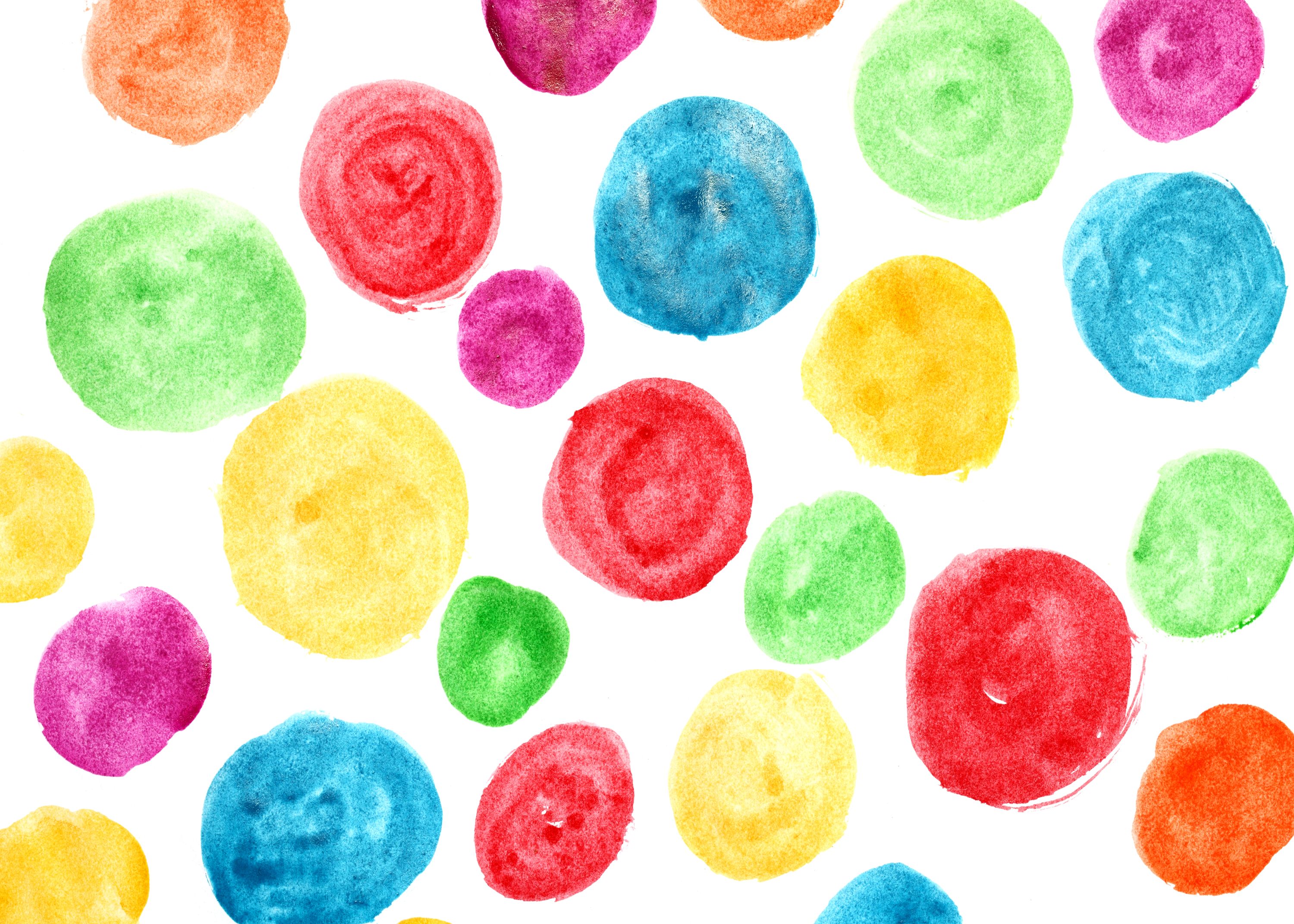 Several colorful dots cover the page in yellow, red, blue and green. 