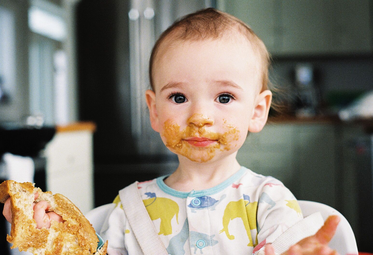 Baby trying peanut store butter first time